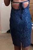 Love this dress!! It's form-fitted but not too tight. I have an athletic build and was in between a medium and a large and I'm very glad I ordered a large! The lace goes past the inside lining which makes the dress long enough- even for a tall girl like me! Also, the slit in the back makes it very easy to walk in and it doesn't make the dress too short in the back! - Jaslyn W.