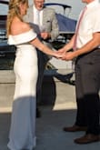 I ordered this dress three days before we decided to tie the knot on our original wedding day, that got pushed back due to COVID. I received sooo many compliments and people thought it was my original gown. The dress itself is thick and has a bit of stretch. It hugs the right places and was perfect for our spontaneous ceremony. I wore 2 inch heels and the height was just right, maybe even a tad long. Buy this dress!! - Courtney M.