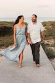 This dress looked absolutely beautiful in my engagement photos on the beach. The medium was a little snug around around my shoulders and I almost wish it was a little longer- I have a long torso so the waist on the dress hit me a little above my natural waist making me look a little wider than I am. Otherwise, the dress was perfect. - Molly F.