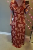 Going to have to get this tailored to fit me too. Sizing guide said that I should be a large (I'm normally a medium but I'm ordering online and so I got with what it told me to get...) I thought it would be OK because it is a wrap dress but when I tie it as tight as I need to it has too much bunching of fabric in the front. It is also extremely long? I have to get it hemmed because the only way I wouldn't trip is if I were wearing 4 inch heels. - Rachel S.