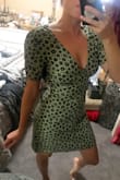 I bought this on sale for half the price it was, it was final sale no returns so I was nervous because all the reviews said it was pretty tight around the waist. I'm so happy I took the chance. It fits me like a glove, like it was made for me. It is a little tighter around my midsection BUT it's a nice material so it's not unflattering. I'm all legs 5'1" and it hits mid thigh. Perfect length. I'm a 32b and the Chest fits beautifully I don't even need a bra. The open back gives it a uniqueness I love. Obsessed. Love you Lulus - Francesca M.