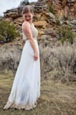 You can't really beat the price or convenience of online ordering for this dress. We had a super small (just family) outdoor wedding and we didn't want to break the bank with my dress. I had an issue with the beading falling apart on the first dress I ordered and customer service replaced it quickly. The straps were definitely long and the dress needed to be shortened for my height, but those were easy alterations. Also, if you are a bit busty like me, it's not the most modest dress. Overall, it is a great dress for the price and perfect for a no-fuss wedding. - Rachel E.