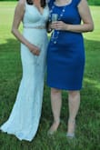 We planned an elopement in 2 weeks, and this dress delivered! I ordered a jeweled belt from Amazon in rose gold and did a few other rose gold accessories, and I loved the overall look. This dress runs long. I am 5'3" and wore 5.5" heels, and it still needed to be hemmed an inch. People were shocked I was able to get a dress in two days for this price. By the end of the night, this dress did have some snags and pilling near the armpits from rubbing, but that's to be expected, and it's a wedding dress; I am not planning to wear it once a week for the foreseeable future so it isn't a problem. - Laura B.