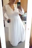 I have a short body and therefore the dress was tight around the waist but large in the arms and any where the lace was on my back.  It is definitely a beautiful dress, I truly wish it was for me.  I'm glad I bought a backup, since the prices are excellent at this companyd - Jessica J.