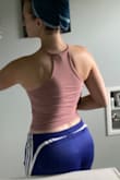 I wanted to love this but it doesn't fit me quite right. I could tell from the model pictures that this has a very fitted look, which is why I went with M/L size, but it's still tighter than I expected. I'm also unsure about the fit of the neckline on me, plus the bottom scrunches up a bit due to my wider waist towards my hips. I debated keeping this (I love the color and how it shows off my shoulders) but decided to return since I don't love how it fits me. - Amanda T.