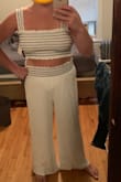 I wore this for my socially-distanced engagement boat party! It was awesome and perfect for the occasion! I am 5'10 and my legs are reeeeally long and I was so excited that the pants were actually long enough on me! Size wise I could've definitely sized down to a large but then I don't think those would have been long enough. I have wide shoulders but am small busted so it was a bit large in there but it didn't bother me at all! I am not a huge crop-top person either, but I absolutely loved it and thought it was classy since we were on a boat. - Hannah S.