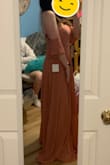 I had been eyeing this dress for awhile and I finally bought it. The fabric is a good quality and the way the skirt falls is absolutely gorgeous. It's very fancy/formal, so I'll have to wait for a special occasion to wear it. It's a bit long but I think I can make do without getting it hemmed if I wear heels. I bought a Small instead of my normal size Medium, so it's a bit tight but I could still squeeze into it even after dinner. The only downside was the pads in the bust. They are a bit awkward for me. From the side especially it's quite obvious they're there (you can't really tell in the picture because of the lighting, but they stand out especially in direct lighting). They don't flatter me and the shape sticks out. I'll have to look into removing them. - Kara G.