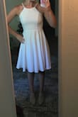 I love this dress. I initially ordered a small but had to exchange for an XS. I'm usually a small, so I might recommend ordering a size down. Both the first dress and the exchange were delivered super fast! I was so impressed with the quality of the dress. It fits perfectly and I love the adjustable straps. It is thick enough that it is not see-through, even in white. I can't wait to wear this for my rehearsal dinner in early September. It's a must have! - Sarah J.