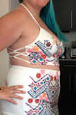 Cute but really impractical for larger breasted people. Embroidery is pretty. The ties in the back are almost impossible to lace by yourself. - Alina Z.