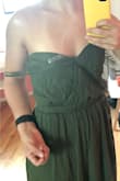 The dress itself is flattering: nice material, color, and cut. I love open-back dresses.
It's a bit too long but that's okay if I wear heels. The top part is too baggy unfortunately. I had to buy body double tape to avoid exposing my breasts but it does not work so well. I'll just have to be extra careful. Also, the strips keep coming  off my shoulders. - Di G.