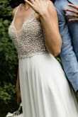 Updating my review because I had my wedding and got to wear this dress. BUY. IT. It is amazing. It fits great, super flattering, looks amazing in pictures and is super comfortable. I wore it all day until we went to bed. We had to cancel our wedding and decided to do a backyard micro wedding, so I ordered this dress instead of my wedding dress. I was highly impressed! - Elise B.