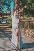 i loveeeed this dress. it made me feel like a princess and i got so many compliments on it! the only thing to be aware of is that the train is very long (4 inch heels in pictures), so make sure to pick it up when you're walking, especially through grass! it'll get caught on with everything because of the lace! - Melanie M.