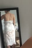 I bought this dress amidst having to postpone my wedding, and no longer needed it. It was tight but felt supportive, which also made it more comfortable and flattering. I would've definitely needed to add cups to this dress, but otherwise, it would've been perfect as is! - Amanda M.