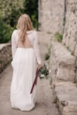 I wore this dress for my wedding - the lace on top was nice quality and the XS small fit super snug so that everything stayed together during the event. I loved the long sleeve look and the back received compliments. It's lightweight and comfortable and I saved so much going this route. - Holly L.