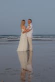 This dress was perfect for our intimate beach ceremony elopement!! This day love won!! - Gloria G.