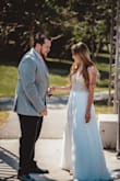 I ordered this dress because it was exactly the style I was looking for at a fraction of the price of bridal boutique dresses. I wore this for my outdoor wedding ceremony & I'm so happy with how sparkly and lightweight it is. You'd never be able to tell it cost under $300. The fit is good overall, (size 4) but just a tad snug in the rib cage area. The bodice has no stretch at all, so if your waist measurement is more than 28" I recommend sizing up. - Jennifer C.