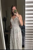 Like many brides, I completely changed my wedding plans due to COVID-19. This dress totally fit my vibe and my personality. I feel super sexy in this and I love love the back. I am a former swimmer, so I have super broad shoulders and back - so I will be having the straps adjusted just a bit to accommodate my large back and also a hem, but otherwise I'm obsessed. Also I am aware my dark red undies are noticeable, but I didn't attempt to hide them in these pics. The dress actually is lined with a nude body suit to address the see through issue! With that and my own nude panties, it should be no problem. I can't wait to wear this on my wedding day. - Kat C.