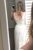 This dress really is pretty, but I didn't really love it on me. Personally, I wasn't a big fan of the skirt due to the top layer's material. If I were to keep it, I would even consider removing the top layer. I liked the top and it fit very well! I will say the length was PERFECT. I think this is a very elegant and classy dress, and the quality was excellent. If this is your style, you won't be disappointed. - Kat C.