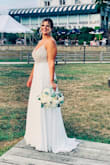 I bought this for a small pandemic wedding. I usually wear a size 8 or 10 dress. The 10 was definitely too big. I had a seamstress put in Larger cups, add more clasps in back and shorten the straps. She also hemmed it. The dress itself is gorgeous! It sparkles but it very heavy and delicate (had to do quite a bit of bead repair!) I wore it on my wedding and got a ton of compliments, but there were a bunch of small pulls in the skirt by the end of the night. - Briana L.
