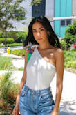 Love this bodysuit and the shoulder detail. I got the white one and it came with a matching hair band. I'm typically an xsmall/small in tops. I ordered the size small and it does fit a little wide. In my photo you can see I had to tie the top as much as possible. I think for a small, it runs big. To see more on how I styled follow me on instagram.com/maitbarri/ - Maitte B.
