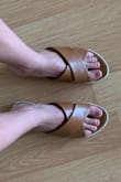 These shoes are super comfy! As you can see from the picture they're a little bit wide but I wouldn't size down because of it. They've gotten quite a bit of wear and still look really good. - Natalia M.