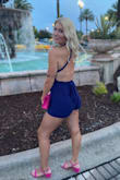 I got so many compliments on this romper. The backless design and the low cut front is such a sexy combo. I wore it with pink heels and a pink clutch purse. I used boob tape to hoist up the ladies lol, but you could def go bra less if you want! - Jessica C.