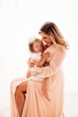 Literally could not have dreamed of a better dress for my Mommy&Me pictures. Usually when you get a dress like this, it is stunning but impossible to move in. This dress was so comfortable and I was fully able to bend over/chase my 2 year old around. 20/10 - Logan J.