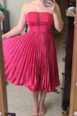 I like this dress a lot! It fit well and I liked that even though I had on a strapless bra, I couldn't see it through the mesh in the middle of the bodice unless I was really looking hard. It's a little wrinkly on the bottom aside from the pleats, so I need to steam it for sure! - Cassidy E.