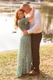 I wore this dress for my engagement photos the other night. It was 95 degrees and I didn't feel too hot because the dress is so lightweight. I wore this with a strapless bra. I'm a natural redhead so the green color really made my hair pop. I got so many compliments on this dress. I am only 5 feet tall and the length was perfect with some wedges. I loved that the dress looked romantic with the off the shoulder sleeves and was flowy with a slit in the front. It looked great in pictures. - Brenna G.