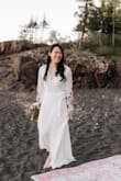 This dress was the BEST find for my last minute elopement due to having to postpone my actual wedding in June 2020. The dress quality is great (not completely sheer but would recommend wearing nude undergarments), embroidery is beautiful and I didn't have to make any alterations to it - I'm average height. I had to use some fabric tape to keep the top in place since I have a smaller bust, but other than that, this dress was perfect! Being a wrap dress allows for flexible sizing. I got so many compliments on how unique and beautiful the dress is. Love, love, love! - Donna W.