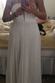 This dress has a lot more weight to it than you would think. It is definitely a contender to be worn on the big day! I am having a beach wedding. It is pretty long, so I would need to hem it and although the fabric is heavy, it is a bit sheer, so be careful with your undergarments! - Tiffany P.