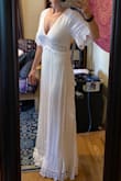I got this dress to change into late night after my wedding. It's so flowy and beautiful. I'm 5'2" and the x-small fits perfectly with 3 inch heels on. It would be a little too long without them though. The detailing on the sides is gorgeous. My only concern is if you want to wear a bra under it you'd have to find one that doesn't show up through the lace. - Samantha H.