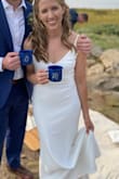 This dress was absolutely perfect for my mountain elopement. It's so flattering. The fit was very good, but I said "a little small" because it really does hug your curves -- leaves nothing to the imagination through your stomach and hips. I had to have the length adjusted for me (which cost more than the dress did!), but the fabric is so simple that the tailor was able to do it very quickly. I also had the adjustable straps changed to non-adjustable. The heavier weight of the fabric makes the dress feel more expensive than it is, and it resists wrinkles well -- just needed to steam it quickly that morning.
Shhh: I couldn't actually find underwear that didn't show at all, so for the ceremony and photos, I went without. You probably could wear a plunge bra with this, but the wires/ridges/seams in the bras I tried changed the look of the bust, so I decided to just wear sticky nipple covers. That was perfect for my small bust, but I'd recommend reading reviews of bigger busted folks if that's a concern. - Marguerite T.