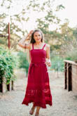 Love this dress. It fits in all the right places and has the tie to sinch in your waist. The pom poms and detail at the bottom are too precious! - Megan S.