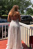 Like other brides our wedding plans changed and we are now planning a micro wedding on a mountain. As soon as I saw this dress I knew it was perfect. Unfortunately it was already sold out in every size so I checked back every single day and ended up buying an M and L. Typically I'm an M in all of Lulus dresses but the L just fit a tiny bit better. The straps on the M were a bit too tight and I liked the deep V of the L better. There was very little difference in the waist size of the M and L. It is a bit see through but it's so sexy and PERFECT. The slit is only obvious if you pull the dress open. I seriously can't wait to wear this for our wedding. - Charlotte W.