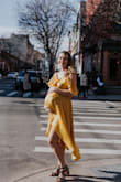 I wore this dress for my baby shower and it fit beautifully. Most longer bulkier dresses made me look like sack of potatoes and I felt beautiful wearing this one;) It covers all the right spots and yet is so light and flows. I also really look forward to wearing it after postpartum. - Elvira K.