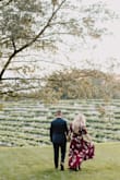 This dress is so flattering and beyond gorgeous! I wore it for my engagement pictures and it photographed SO well! I'm 5'8" and wore a small. Normally I don't like traditional "wrap" dresses because they never seem to be cut correctly, but this one is perfect! If you are bustier I would size up, I'm a 34B and would say it was just right, but could see how it may be a little revealing + not as stable in the front for someone bustier. - Maria E.