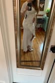 I bought this dress with no reviews and no pictures of a model wearing it! I figured it's cheap enough and I can return it if it's not cute lol but ITS AMAZING! It's going to be perfect for my wedding and fits me like a glove! I am a curvy girl 5'5" 170lbs and 38DD and I ordered a large. I do need to wear a Bra with it and some spanx (I am only wearing a bra in the photos) lol but I'm super happy with this dress. It's beyond anything I could have expected. It's satin material with a nice layer inside to which nicely hides all my tattoos so they don't show through the dress at all! Pics are from it straight out of the box so it still needs to be dry cleaned to remove the wrinkles. - Georgia D.