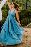 This dress is beautiful, however, the bust region was nearly impossible to work with. I have a larger bust, so I used Kinesiology Tape (would not necessarily recommend unless it's a one-time thing), AND tape to stick the dress down. The dress tape didn't stick well and showed a lot of unwanted skin. Other than all the work needed, it is a beautiful dress! It is heavier, but is a very good quality. I am normally a Medium (size 6) in dresses, however, I have a small waist and because the boob area was so large, I squeezed into an XS. I would highly recommend going at least one size down! - Emily V.