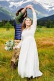 I absolutely love the lace details on the dress and the simplicity of the skirt. It was a perfect gown for our nature-inspired destination wedding! I had the neck-line lowered and had it hemmed on the bottom and sleeves to fit. - Lauren N.
