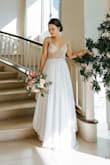I can't believe how beautiful this dress is in person. There's nothing else I could say other than please don't think twice. Just buy it. You will not regret it for one second. Everyone at my wedding said the sparkle looked like real diamonds in the light and they never guessed it was this cheap! Such a steal! - Faith K.