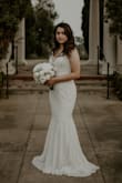 I bought this dress for my courthouse wedding. I wanted to feel like a bride without the price tag, especially because we wanted to take pictures. I felt so beautiful in this dress. I lost some weight before the wedding, so it may have just been me, but it felt like it wasn't very tight on me, but I didn't mind. It also runs super long, I'm glad I wore flats with my dress because I tripped over it more than once! But this dress was a dream, I knew it was the one as soon as I tried it on. - Victoria N.