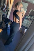 This jumpsuit fits perfectly! The shape is very flattering, and the material fits nicely to your body as it's stretchy! I didn't need to wear a bra with this which was nice. I wore this to a wedding & I got so many compliments! If you're on the line of ordering a small vs. medium.. I would go with a small (personally) because of the stretchy material. This jumpsuit is amazing! - Emma H.