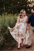 Perfect for my engagement photos! Moved in the wind well. I loved it!! 
I'm 5'4 and 145 pounds. Bought a medium. Zips up really well, but it's a little loose / big in the breast And shoulder area, and I don't have small breasts. I had to have it tailored. - Laura B.