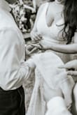 Due to COVID, our plans changed from formal wedding to backyard wedding! The dress I had was not suitable for our backyard and I wanted something more romantic and flowy for the change of plans. This dress was extremely soft and the lace was beautiful. Felt casual enough yet fitting for a bride! Material was stretchy and very comfortable. Threw it in the wash after the wedding and air-dryed it back to normal! Length was perfect with 2.5-3 inch heels and didn't drag too much. - Shiva T.