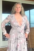 Cute dress! Bought a large (wear a 12/14 usually). Plenty of room in hips. Problem is the bust area. I was hoping I could   tack it a bit but it was so snug around my back that there was no extra material to tack. Had to send back. And I am not busty. - Karen K.