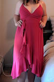 I love this dress! It is super flowy and comfortable when you walk, and photographs well (the color is so vibrant =
). Its a true wrap dress, and the only reason I give it 4 stars instead of 5 is because the bust is too loose (can't wear a strapless without it being seen), and I either have to tie it so tight that it suffocates my rib cage, or use an obscene amount of boob/dress tape. Because I have to tie it so tight to cover my chest, it accentuates my hips which I'm trying to make less noticeable with the wrap-style dress. Otherwise, its gorgeous! - Jordan M.
