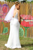 Amazing dress for a backyard wedding, has great little details like the peek of lace at the hem in the back, buttons down the back and lace detail v neck. We did have it altered for my mother in law because it was too long (ordered a large to be safe). Dress is lined and not see through the right foundation garments make a world of difference. Our seamstress also took the extra fabric from the hem and made a belt to complete the look. - Jennifer F.