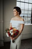 My husband and I had to reschedule our big wedding celebration for next year, but still had an intimate ceremony this year.  This dress was absolutely perfect.  Simple, elegant and comfortable!  Received MANY compliments! Photo credit to Brandi Doleman Photography - Genevieve S.