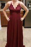 I was between a small and a medium because my waist is 30". I ordered both, tried on the small, and it fits perfectly up top! I didn't even take the medium out of the bag. I'm 5'4" and I did have to hem. - Alexis S.
